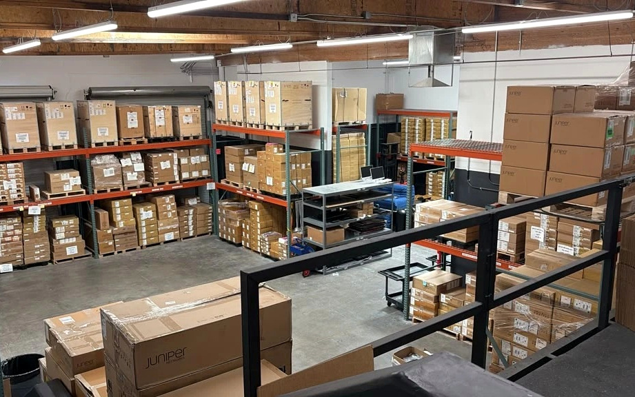 The warehouse seen from the mezzanine, racking and boxed stock below