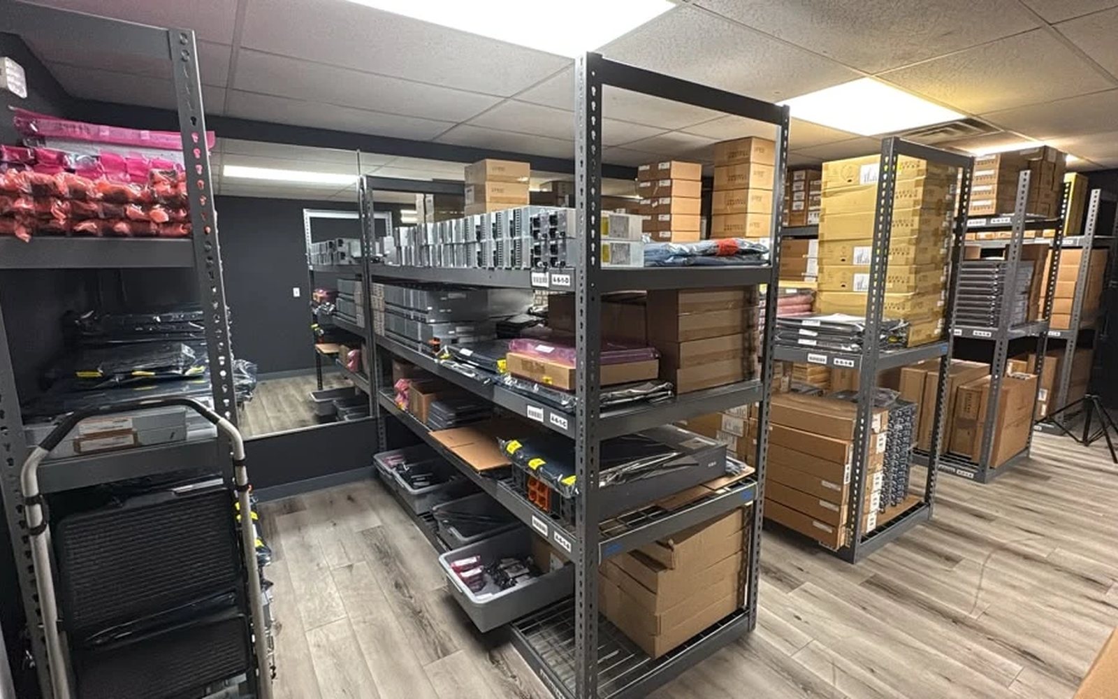Boxed HPE Juniper and Cisco stock on the pick shelves at our Las Vegas facility